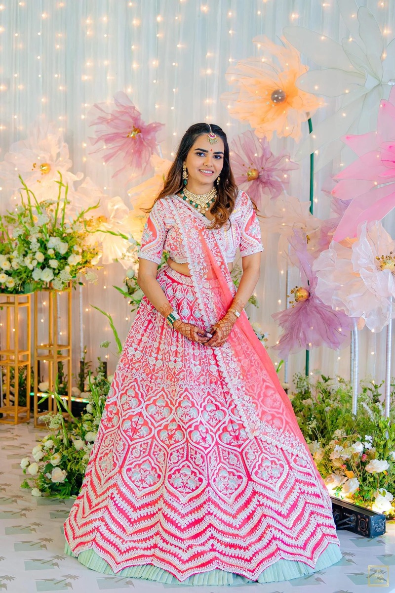 Bride in a pink and white embroidered lehenga styled by Shreya Gupta Kedia