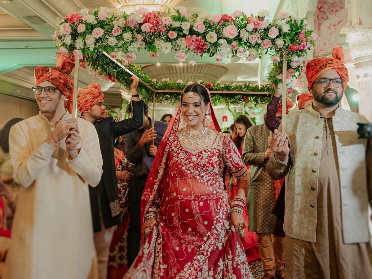 Bride getting dressed by wedding stylist Shreya Gupta Kedia